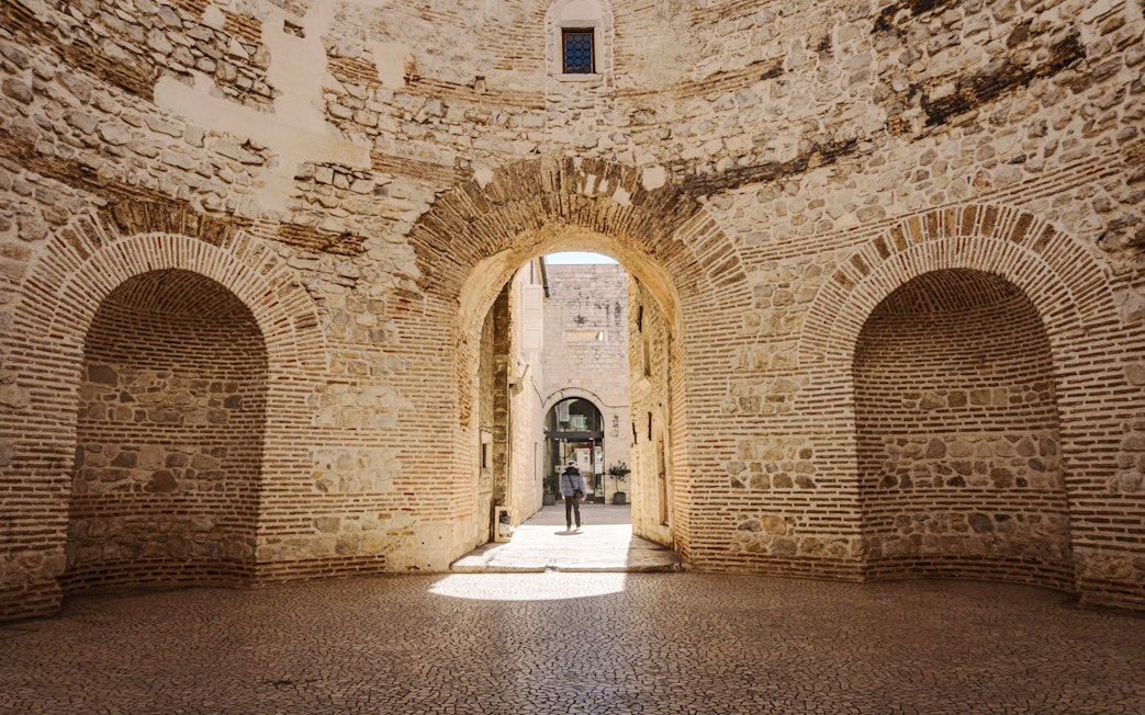 Interior view of the vestibule in Diocletian's Palace, Split, Croatia, showcasing ancient stone arches.