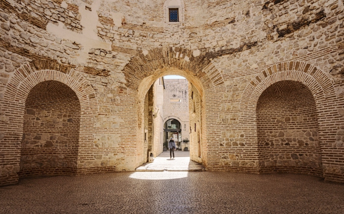 Interior view of the vestibule in Diocletian's Palace, Split, Croatia, showcasing ancient stone arches.