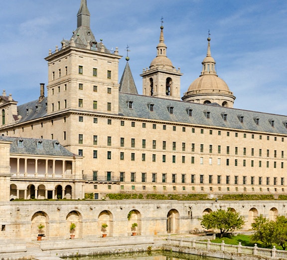 El Escorial monastery with reflection in pond, San Lorenzo de El Escorial, Spain.