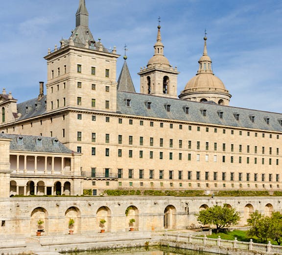 El Escorial monastery with reflection in pond, San Lorenzo de El Escorial, Spain.