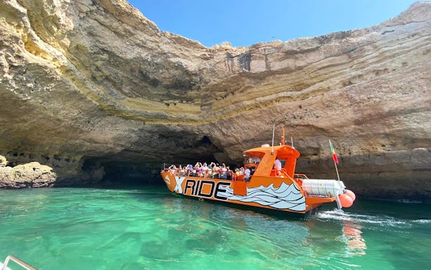 Boat entering sea cave on X Ride Dolphin and Caves Tour, Algarve coast.
