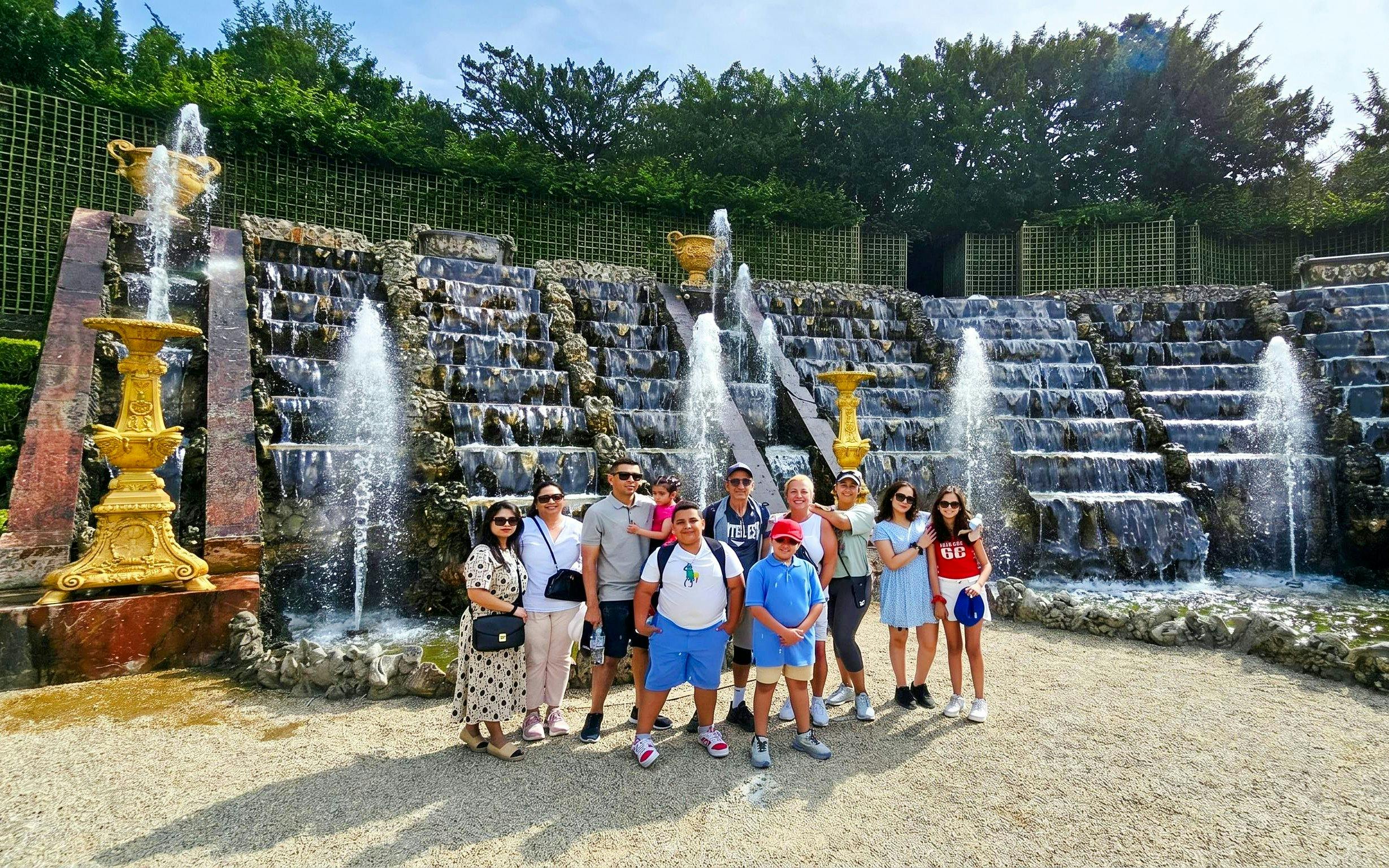Group in front of Versailles fountain during golf cart and bike tour.