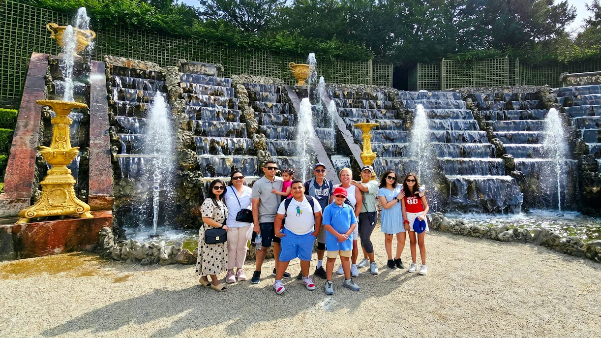 Group in front of Versailles fountain during golf cart and bike tour.