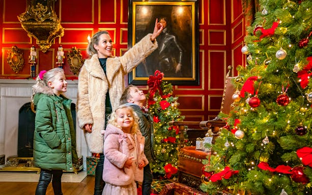 Family enjoying Christmas decorations at Warwick Castle.