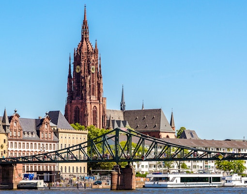 Frankfurt skyline with Saint Catharine's Church and Eiserner Steg bridge.