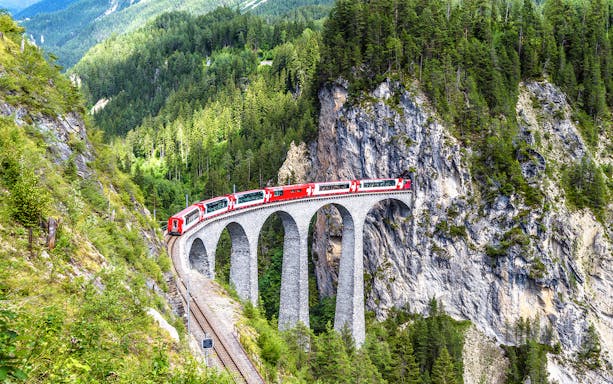 Train crossing the Landwasser Viaduct in Switzerland with Eurail Pass.