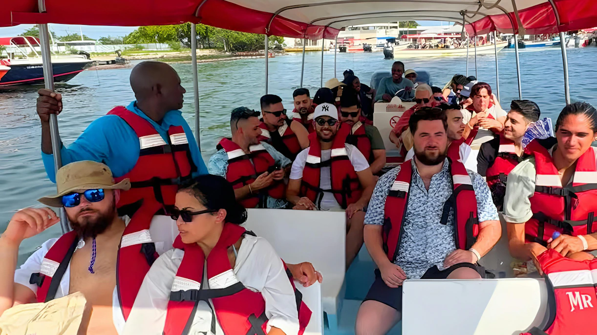 Tourists on a boat tour to Rosario Islands, Cartagena, Colombia, wearing life jackets.