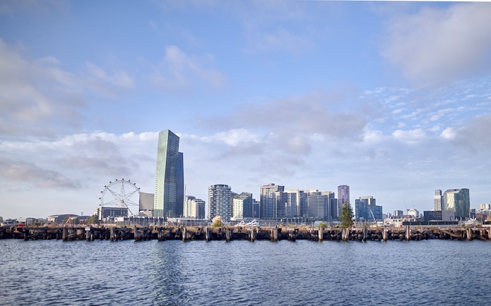 Melbourne skyline with Ferris wheel and waterfront view from Williamstown Ferry Cruise.