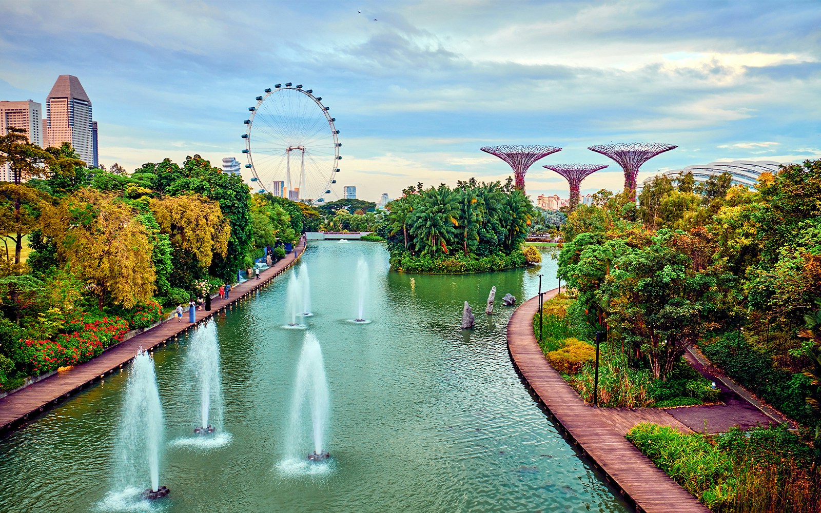 Gardens by the Bay Supertree Grove in Singapore with illuminated tree-like structures at night.