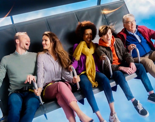 People enjoying a flight simulation ride at This is Holland experience.