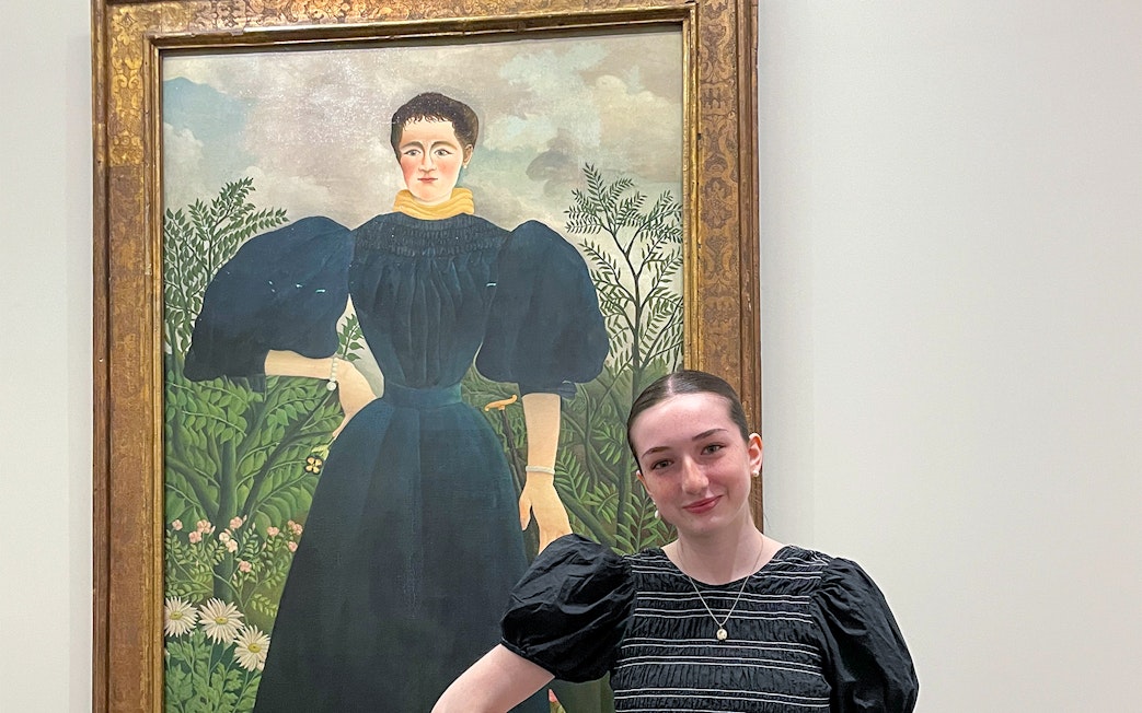 Painting at Orangerie Museum with visitor standing nearby.