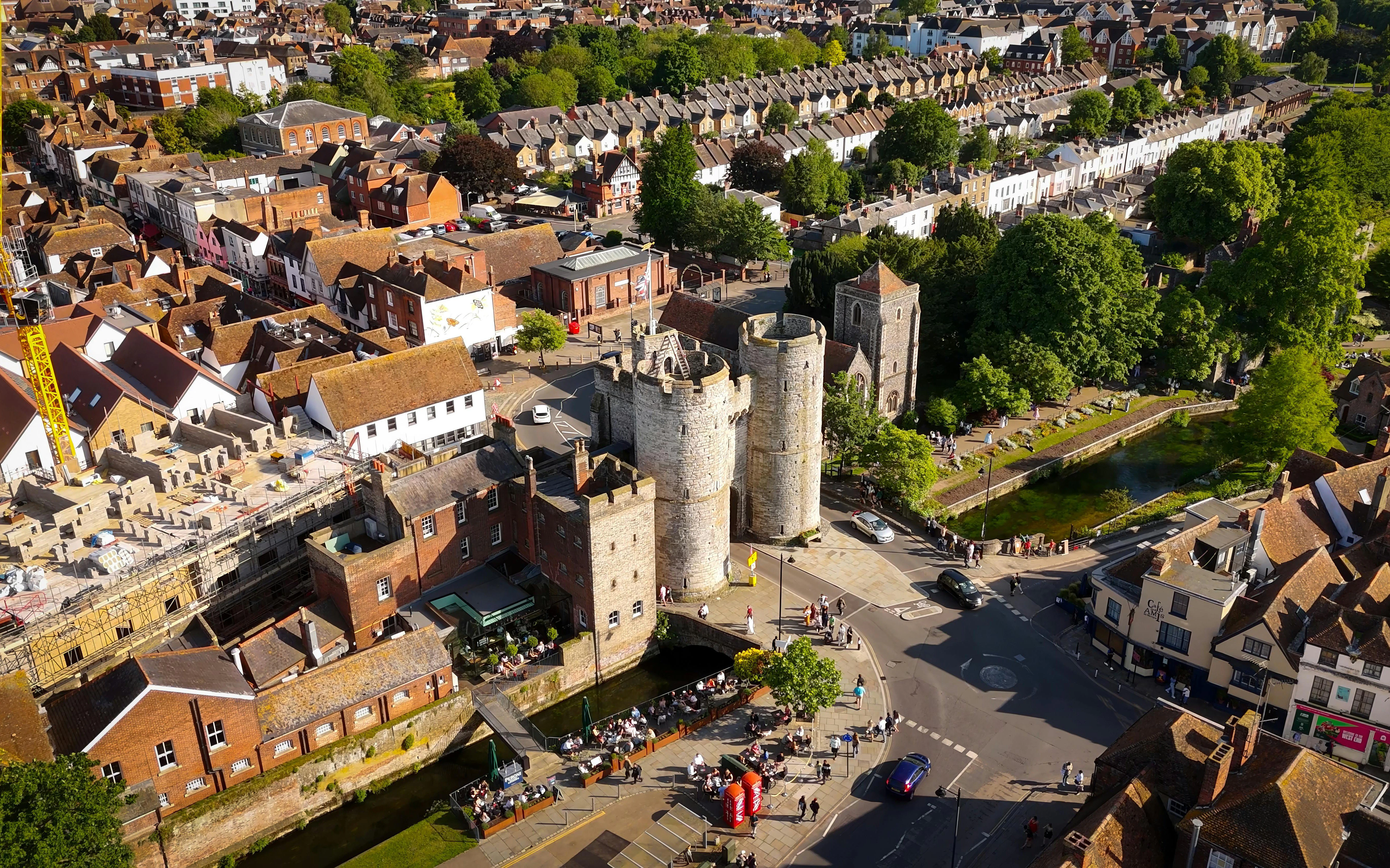 Aerial view of Westgate Towers in Canterbury surrounded by historic buildings and greenery.