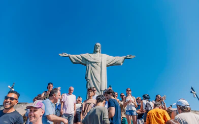 Tourists at the base of Christ the Redeemer statue in Rio de Janeiro, Brazil.
