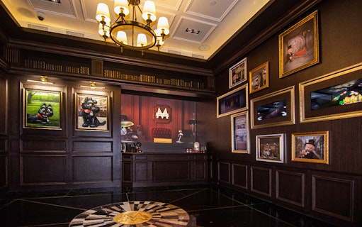 Interior of MONOPOLY DREAMS™️ Hong Kong with themed artwork and decor.