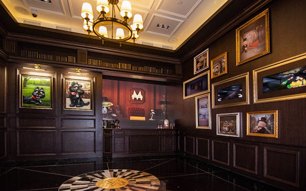 Interior of MONOPOLY DREAMS™️ Hong Kong with themed artwork and decor.
