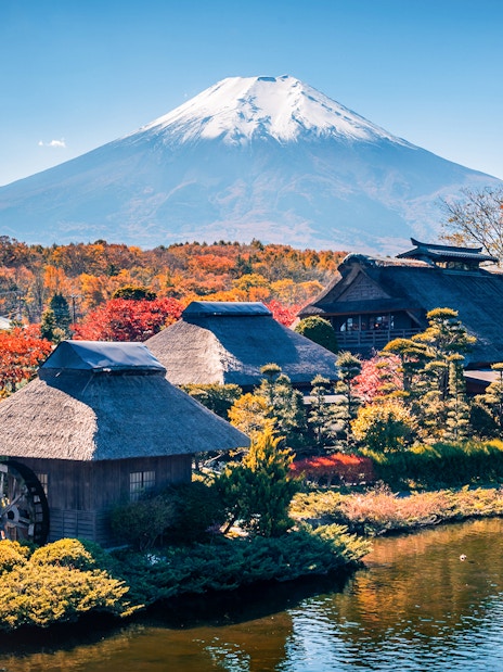 Traditional Japanese village with Mount Fuji in the background near Lake Ashi.