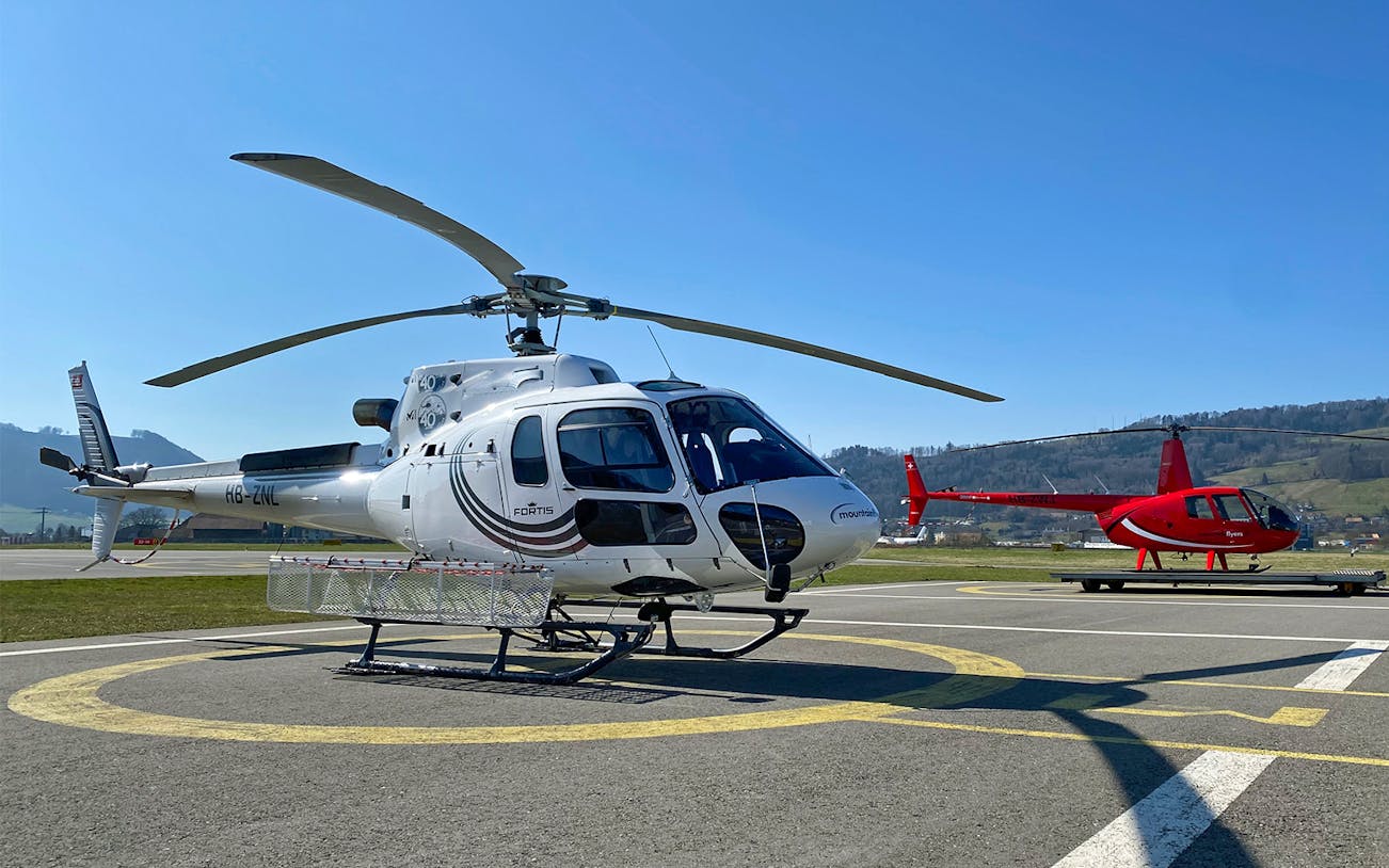 Helicopters on a helipad ready for a Matterhorn tour in Switzerland.