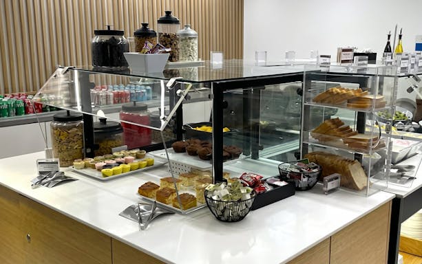 Snack and beverage selection at HelloSky Lounge, JFK Terminal 4, New York.