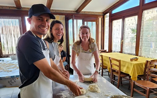 Participants making pasta dough in an Amalfi Coast cooking class.