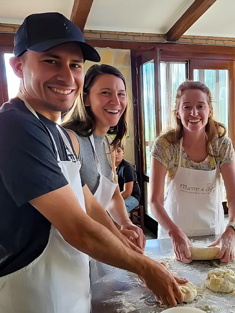 Participants making pasta dough in an Amalfi Coast cooking class.