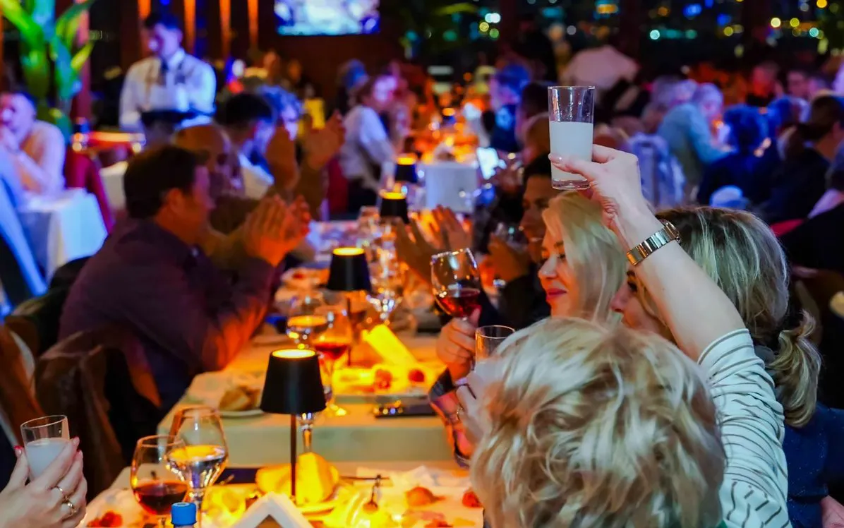Guests toasting on a Bosphorus dinner cruise in Istanbul.