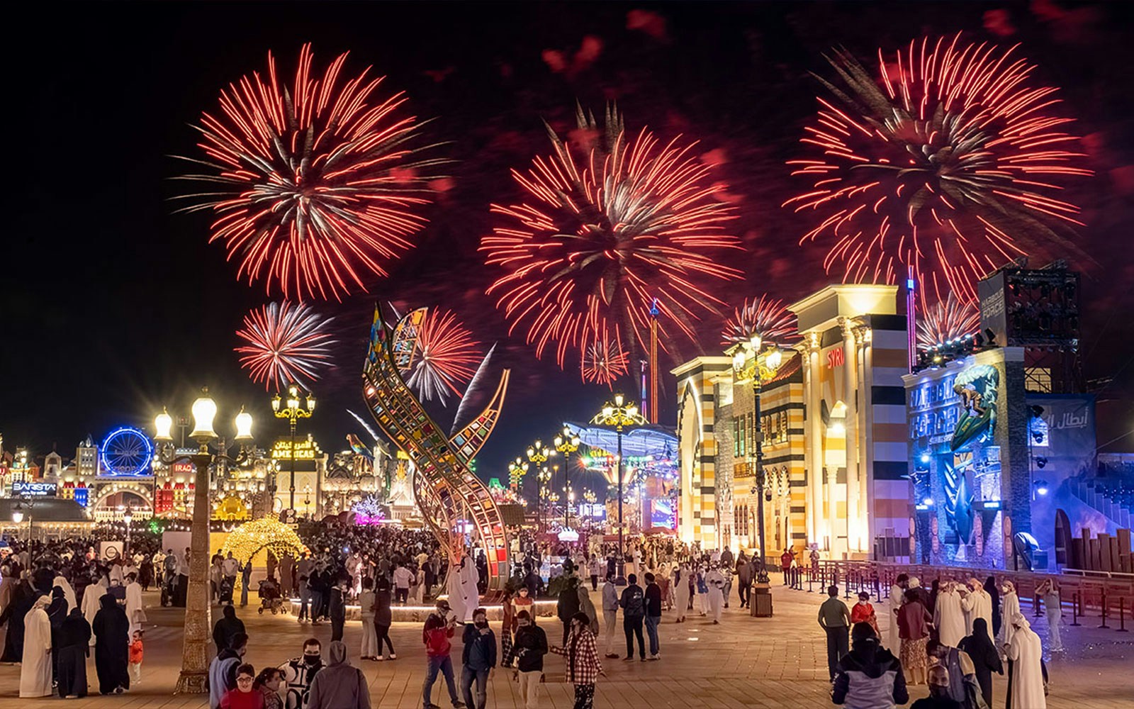 Fireworks display over Global Village Dubai during New Year's Eve celebration.