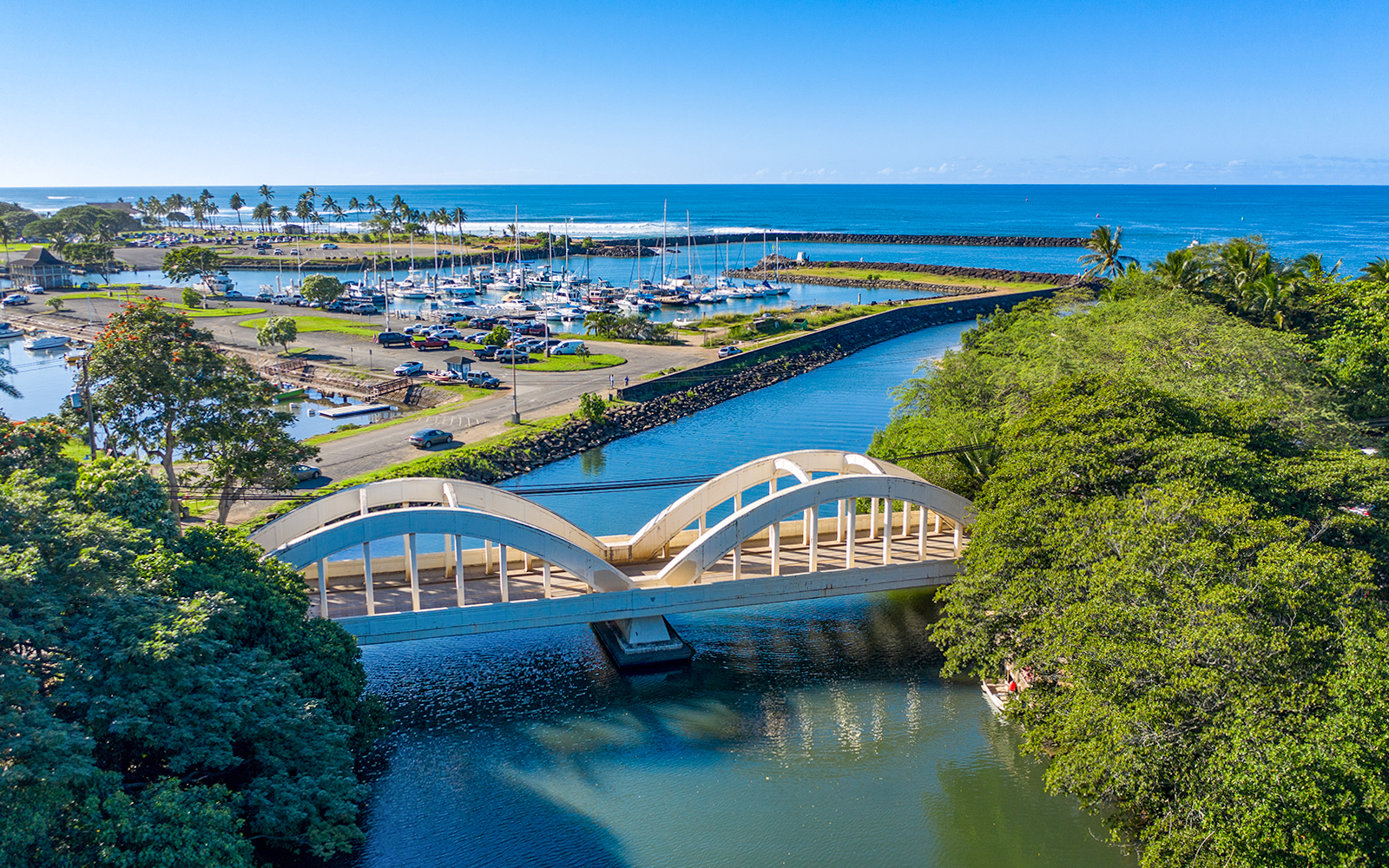 Aerial view of Haleiwa Bridge and marina on Oahu's Grand Circle Island tour.