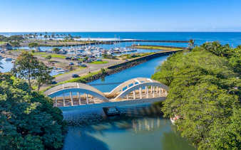 Aerial view of Haleiwa Bridge and marina on Oahu's Grand Circle Island tour.