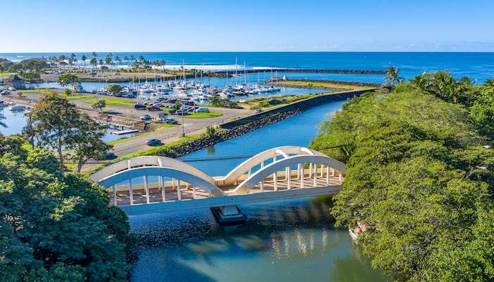 Aerial view of Haleiwa Bridge and marina on Oahu's Grand Circle Island tour.