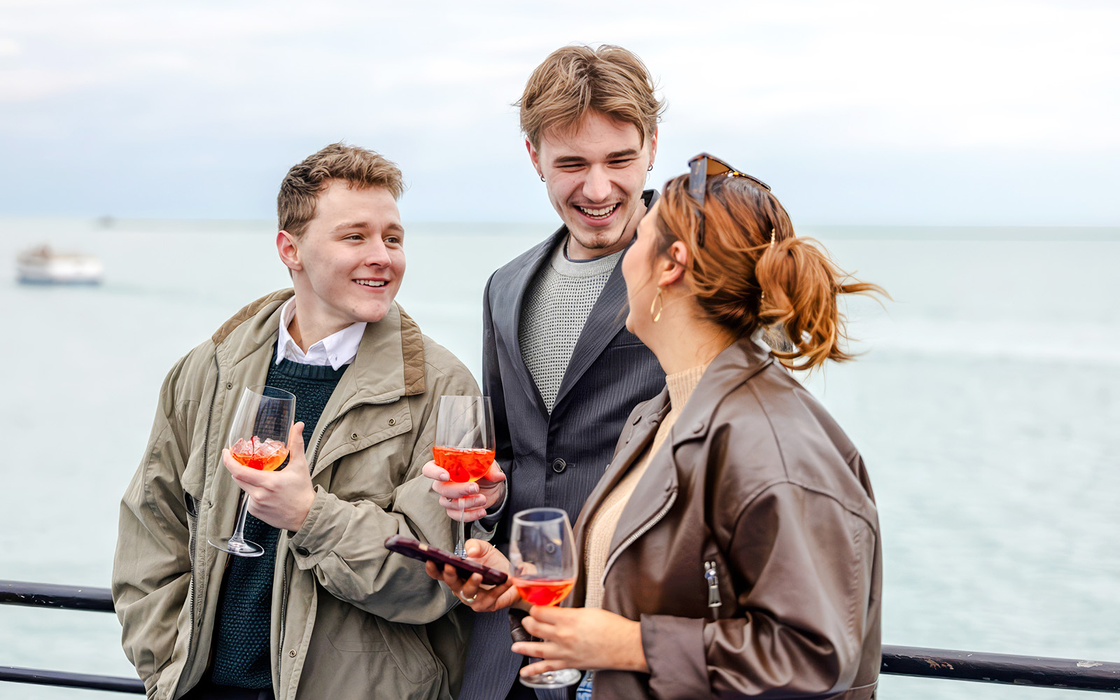 Group enjoying drinks on a Chicago River cruise.