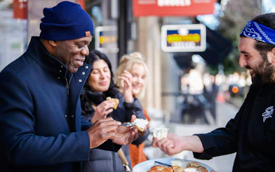 People enjoying a tasting experience on a street food tour in South Lake Union.