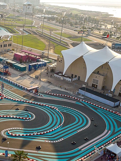 Aerial view of Yas Marina Circuit with winding track and surrounding facilities in Abu Dhabi.