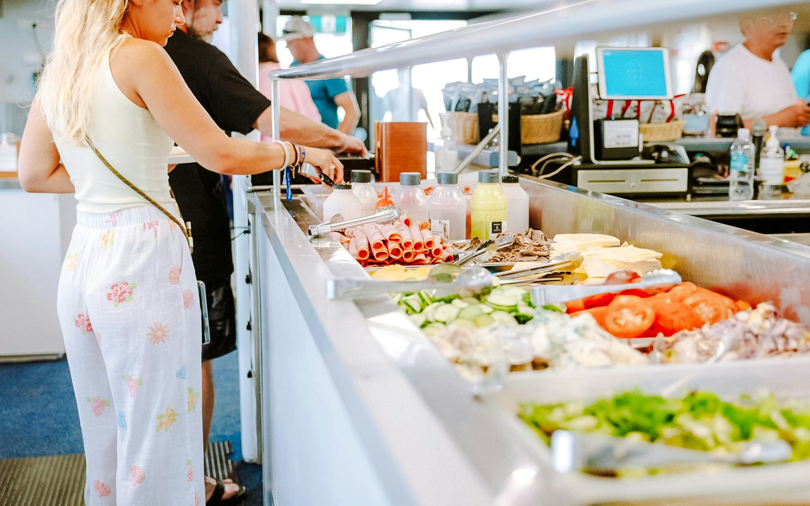 Buffet lunch setup on a Great Barrier Reef cruise with fresh vegetables and meats.