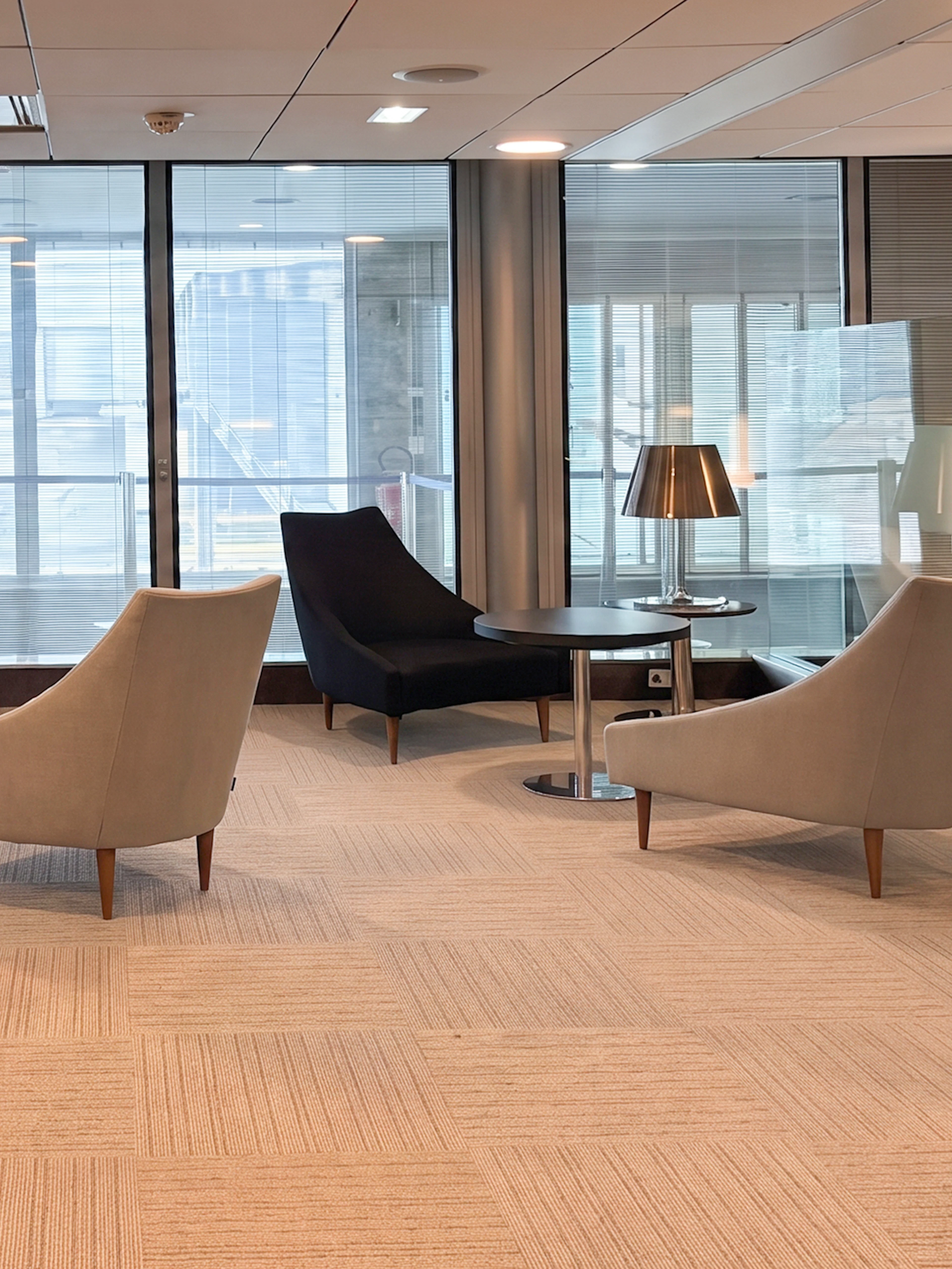 Seating area in Salon Paris at Charles de Gaulle Airport Terminal 2C.