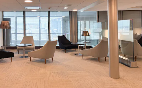 Seating area in Salon Paris at Charles de Gaulle Airport Terminal 2C.