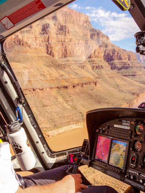 Helicopter pilot flying over Grand Canyon during Las Vegas to Grand Canyon West tour.