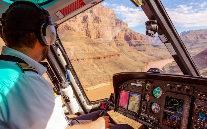 Helicopter pilot flying over Grand Canyon during Las Vegas to Grand Canyon West tour.
