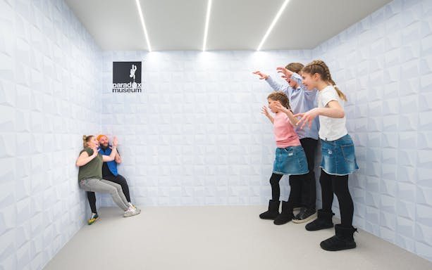 Visitors exploring interactive exhibits at Paradox Museum, Stockholm.