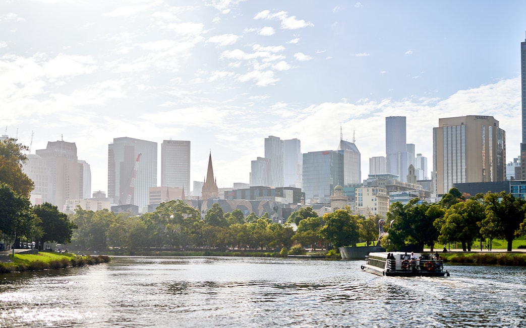 River cruise on Yarra River with Melbourne skyline in the background.