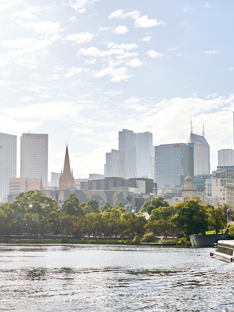 River cruise on Yarra River with Melbourne skyline in the background.