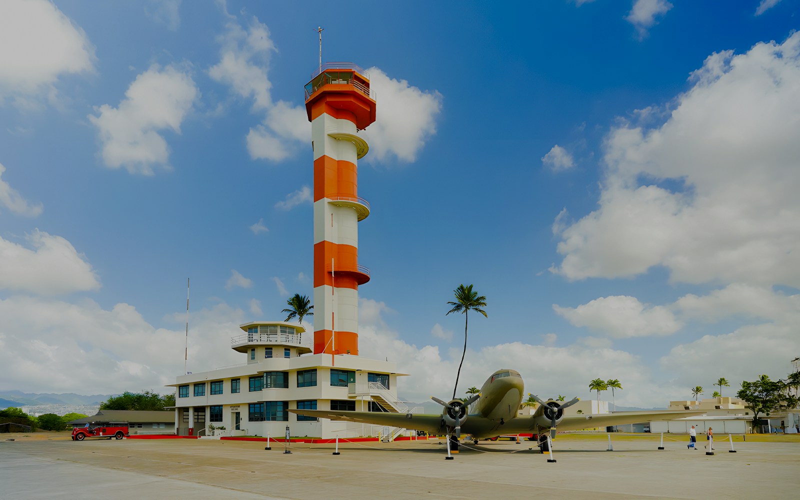 Pearl Harbor Aviation Museum exterior with vintage aircraft display, Honolulu, Hawaii.