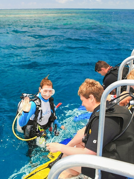 Snorkelers preparing to dive from a boat near Low Isles Island, Port Douglas.