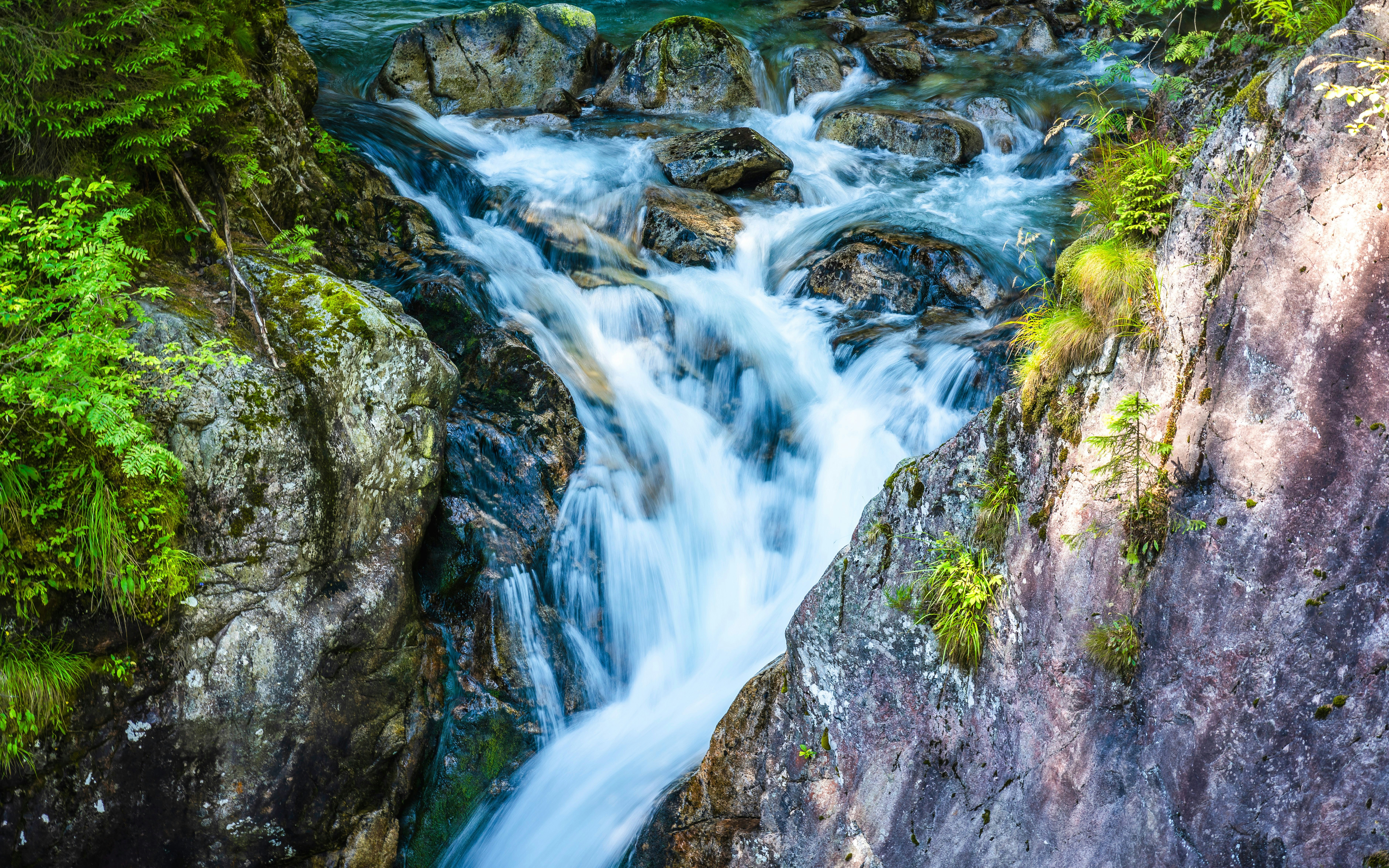 Wodogrzmoty Mickiewicza waterfall cascading over rocks, Morskie Oko, Poland.