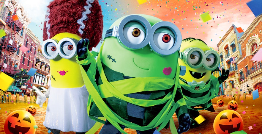 Minions in Halloween costumes at Universal Studios Japan with festive decorations.