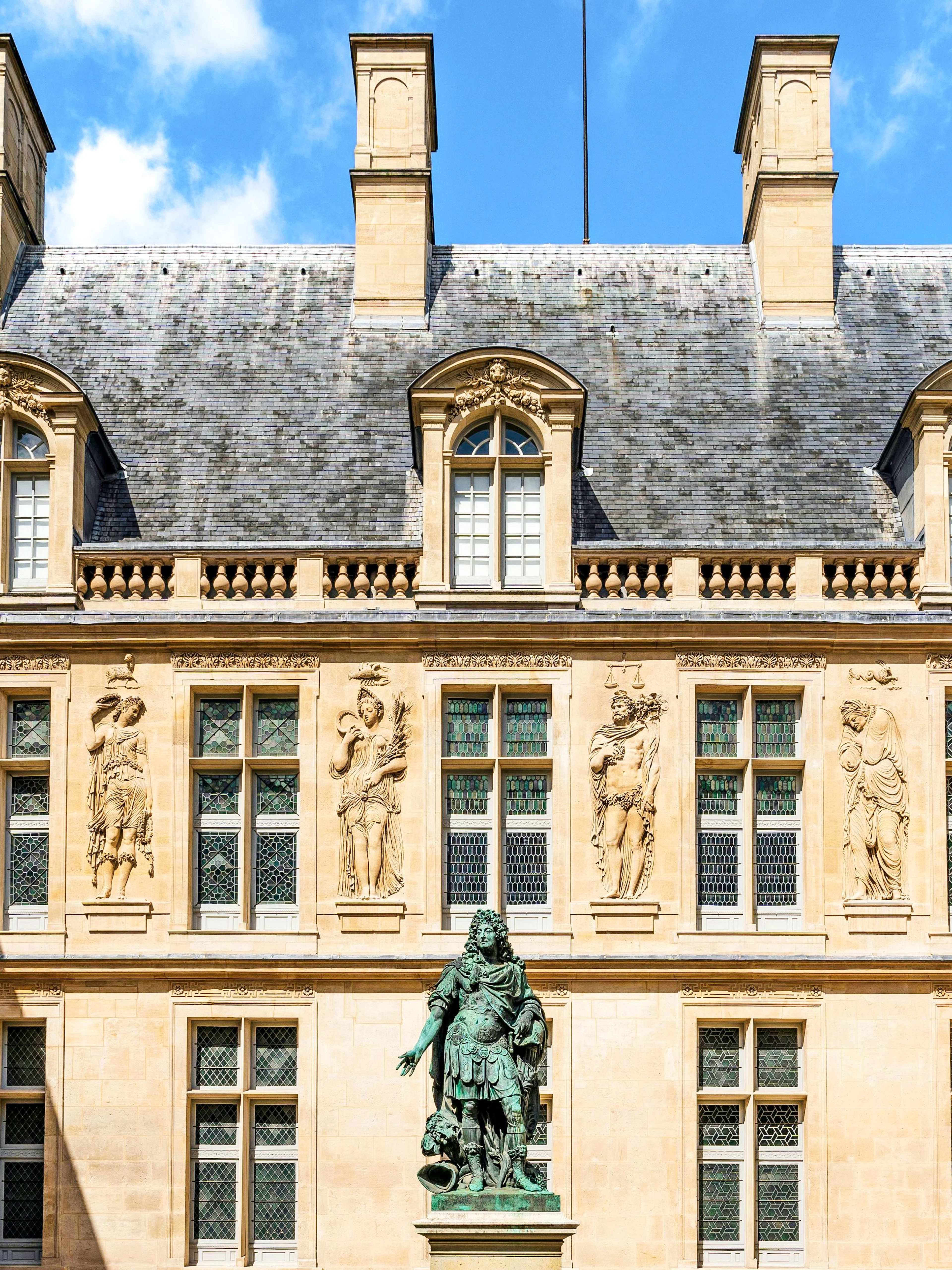 Main courtyard of Carnavalet Museum with Louis XIV statue, Paris city center, France.