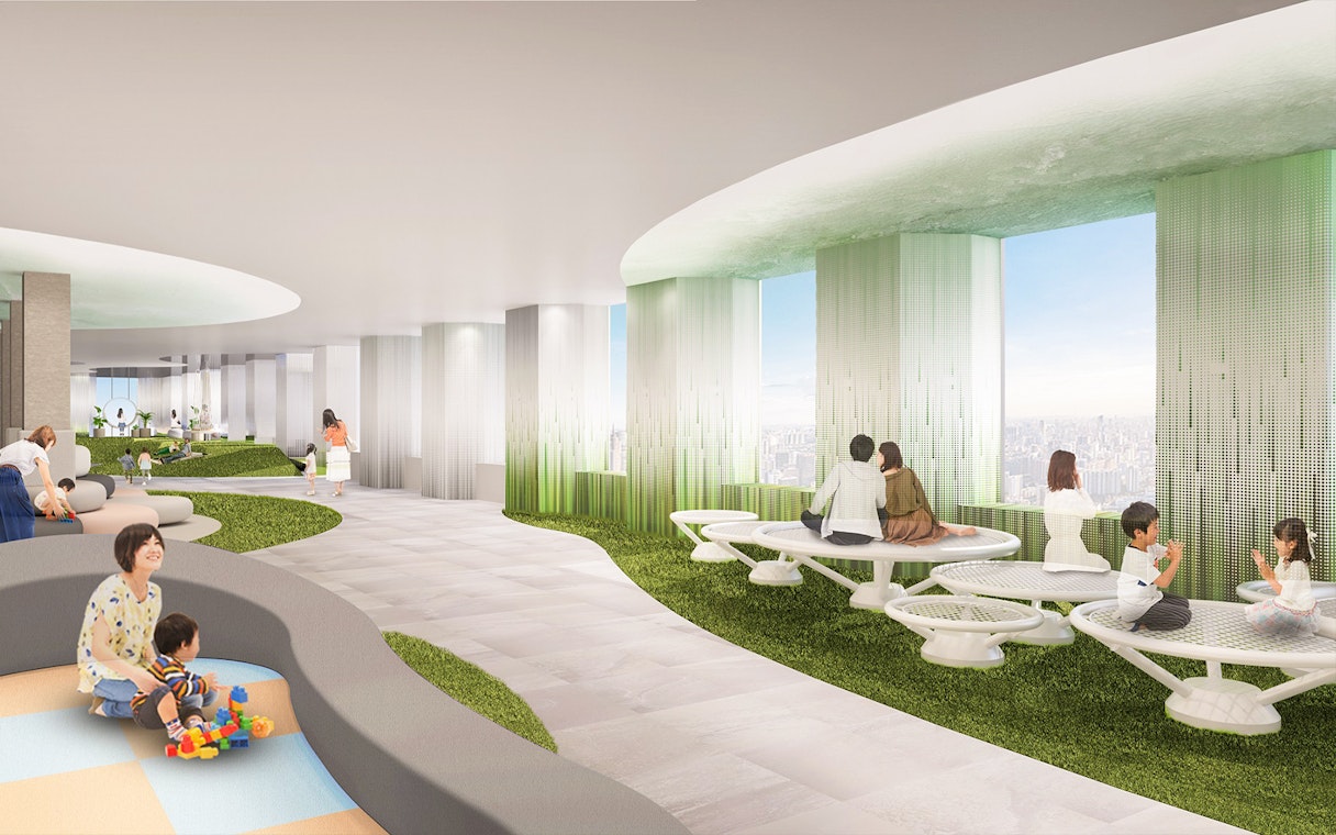 Visitors enjoying the view and relaxing at Sunshine Aquarium's indoor seating area.