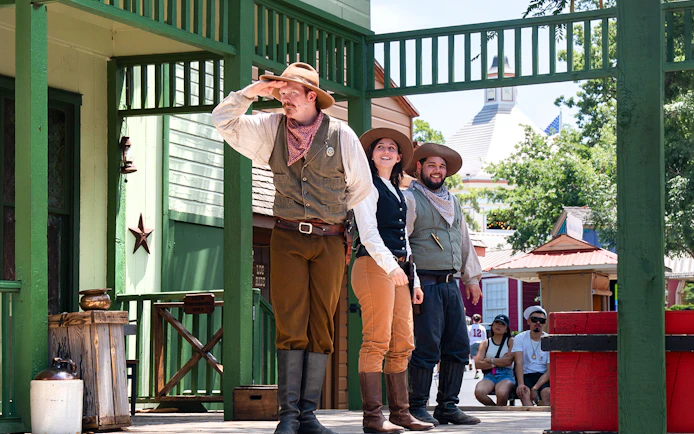 Performers in cowboy attire during the Texas Justice Stunt Show at Six Flags Over Texas.