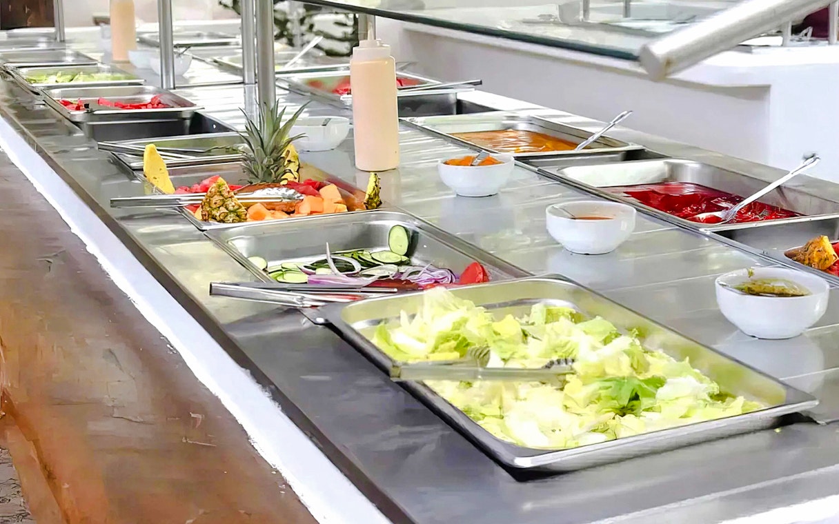 Buffet with fresh salads and fruits at a beach club in Isla Mujeres.
