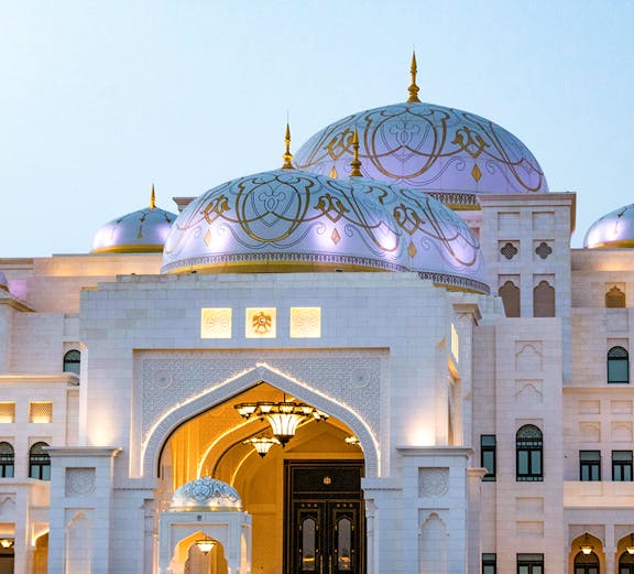 Qasr Al Watan palace entrance in Abu Dhabi, showcasing intricate domes and architecture.