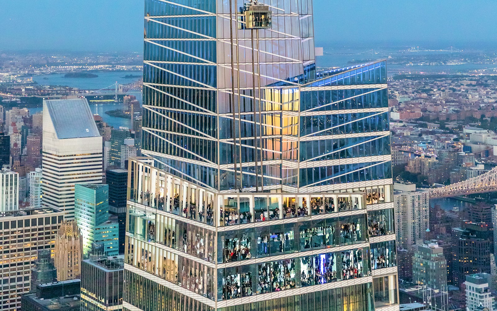 Aerial view of SUMMIT One Vanderbilt in New York City with surrounding skyscrapers.
